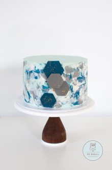 Blue textured cake with hexagons on the side