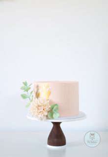 Pastel cake with sugar dahlia and eucalyptus decorations