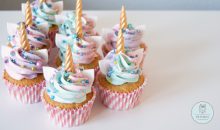 Pastel cupcakes with unicorn horns and colorful pastel buttercream on top