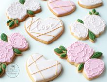 Pink cookies with hearts and peonies decorations